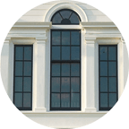 Three fancy, white Palladian style windows 