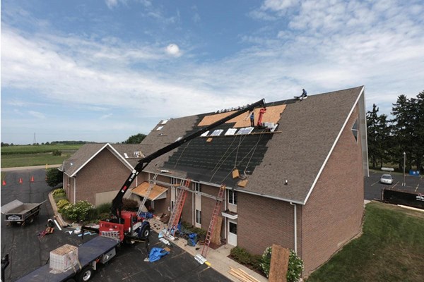 new roof being installed on a church in michigan