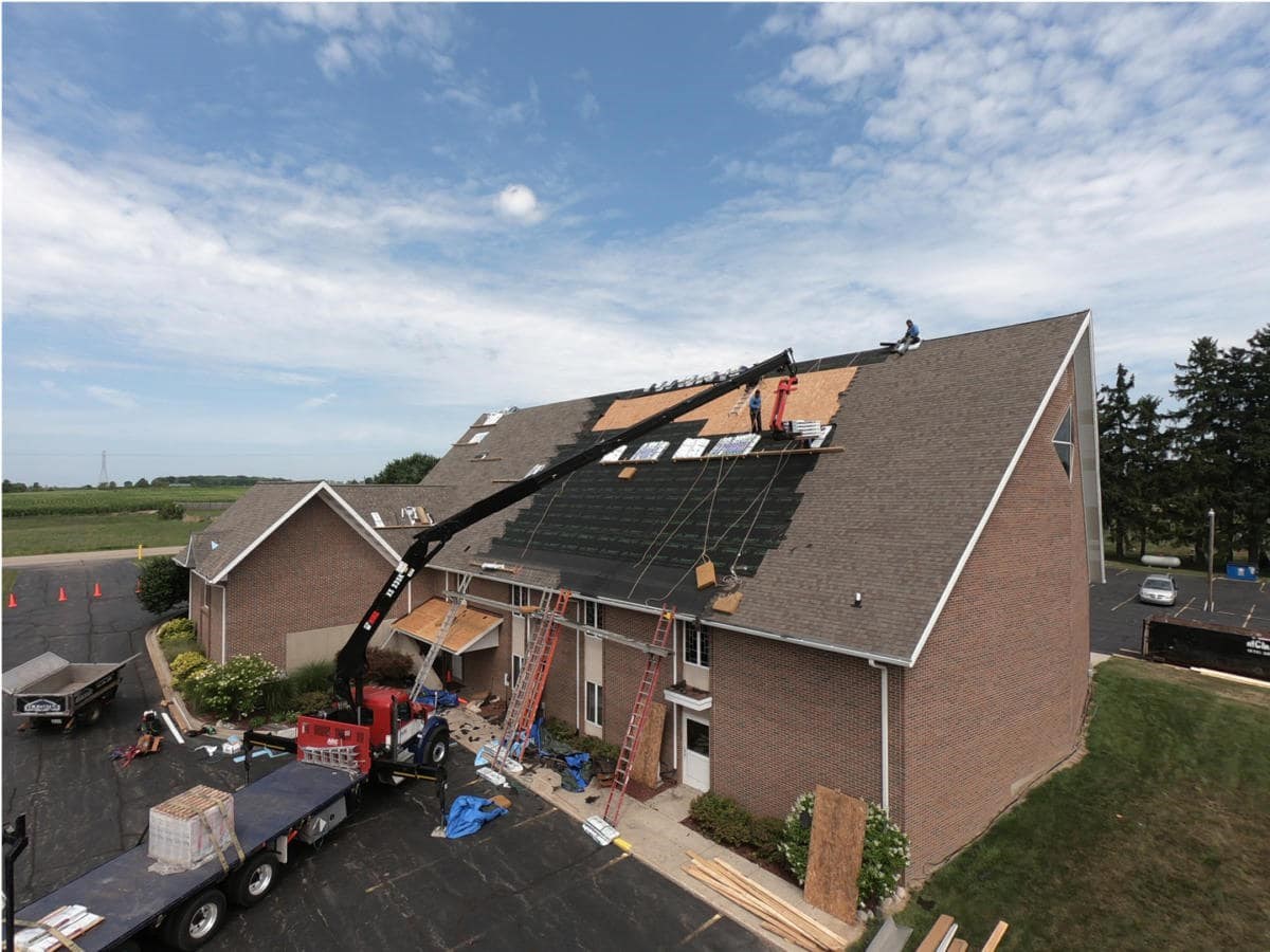 new roof being installed on a church in michigan