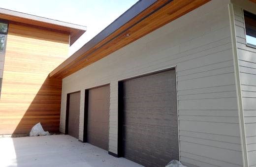 replacing siding on a modern home in michigan