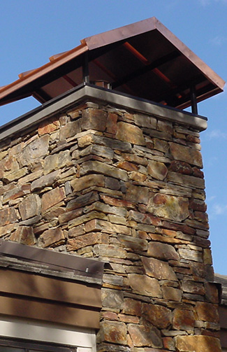 Custom chimney cap on home in Grand Rapids
