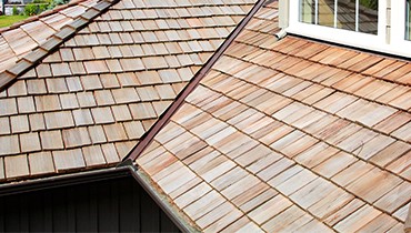 Cedar shake or composite roofing is a classic look, durable, and long-lasting