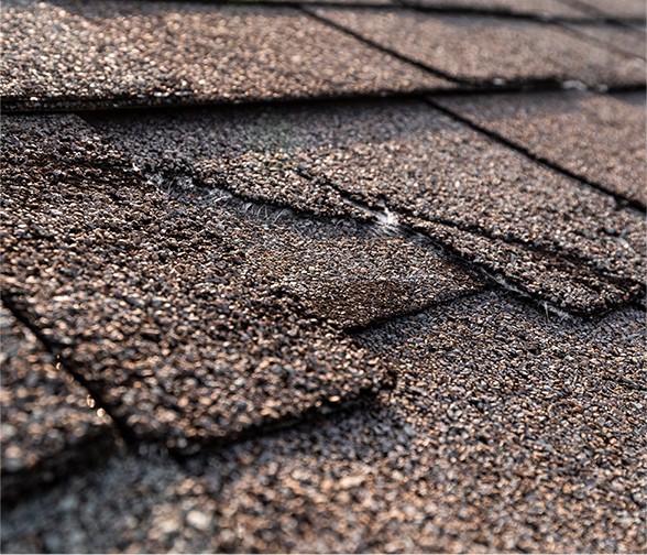 Ice dam damages roof shingles